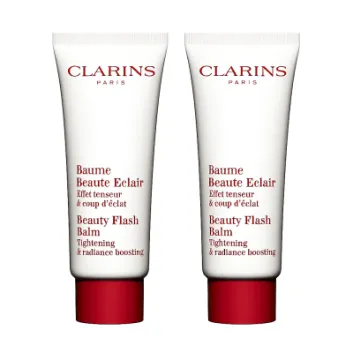 Two 50ml tubes of Clarins Beauty Flash Balm, known for tightening and radiance boosting, are displayed against a white background.