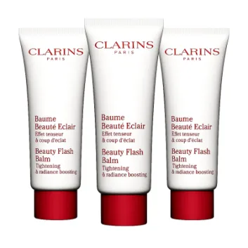 Three tubes of 3x Clarins Beauty Flash Balm 50ml with red caps are shown side by side, described as skincare products for tightening and boosting radiance.
