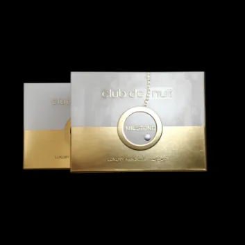 Two rectangular perfume boxes labeled "club de nuit Milstone," with a metallic gold and silver design, partially overlapping each other on a white background.