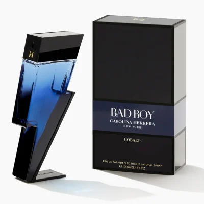 A blue lightning-bolt-shaped bottle of Carolina Herrera Bad Boy Cobalt EDP for Men, 100ml, stands beside a black rectangular box.