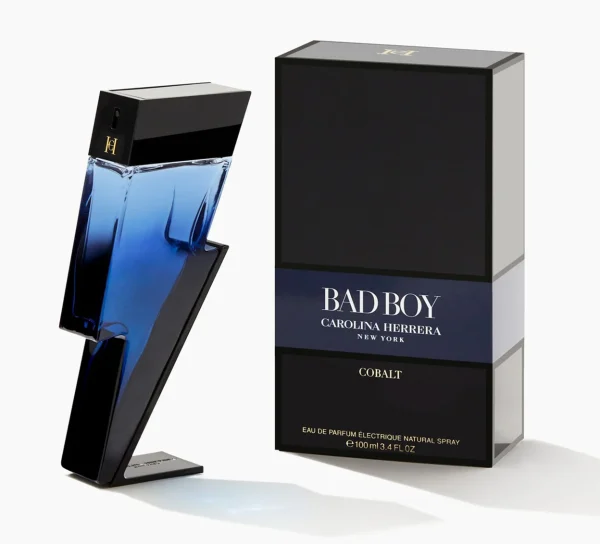 A blue lightning-bolt-shaped bottle of Carolina Herrera Bad Boy Cobalt EDP for Men, 100ml, stands beside a black rectangular box.