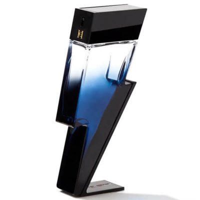 The Carolina Herrera Bad Boy Cobalt EDP for Men (100ml) features a blue and black perfume bottle shaped like a lightning bolt, standing upright on a flat base.