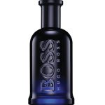 A dark blue glass bottle of Hugo Boss Boss Bottled Night EDT Spray for Men, 100ml, with "BOSS" and "HUGO BOSS" embossed vertically on the front.