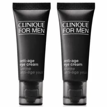 Three identical black tubes of Clinique for Men Age Defense for Eyes 15ml are standing upright on a white background.