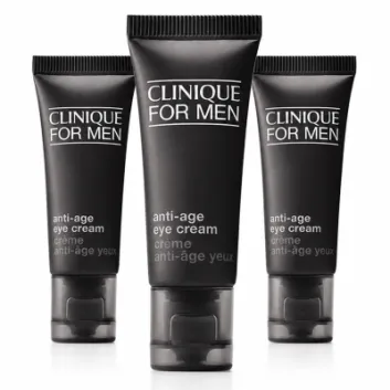 Three tubes of Clinique Clinique for Men Age Defense For Eyes 15ml are standing upright on a white background.
