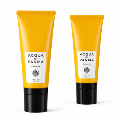 Two yellow tubes of Acqua di Parma Barbiere Multi Action Face Cream 50ml stand upright against a white background.