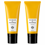 Two yellow tubes of Acqua di Parma Barbiere Multi Action Face Cream 50ml with black caps stand upright on a white background.