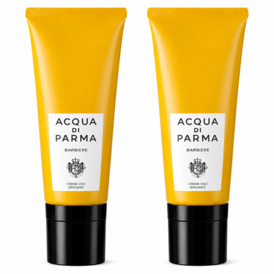 Two yellow tubes of Acqua di Parma Barbiere Multi Action Face Cream 50ml with black caps stand upright on a white background.