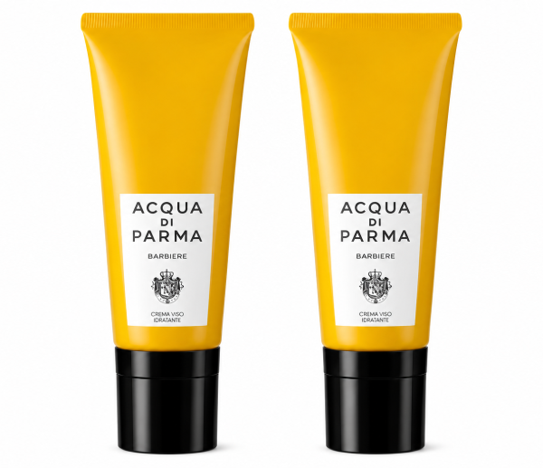 Two yellow tubes of Acqua di Parma Barbiere Multi Action Face Cream 50ml with black caps stand upright on a white background.