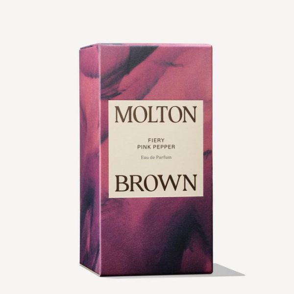 A rectangular box of Molton Brown Fiery Pink Pepper EDT for Men and Women (100ml), featuring a pink and black marbled design with labeled text on the front.
