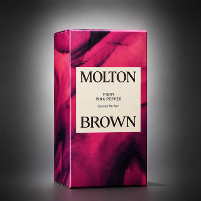 A 100ml rectangular box of Molton Brown Fiery Pink Pepper EDT for Men and Women, with a pink and black marbled design and a bold front label.