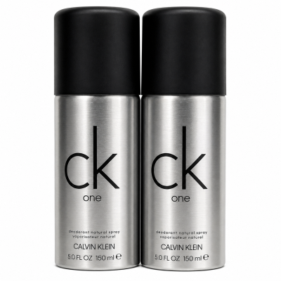Two silver 150 ml cans of Calvin Klein CK One deodorant natural spray with black caps are placed side by side against a white background.