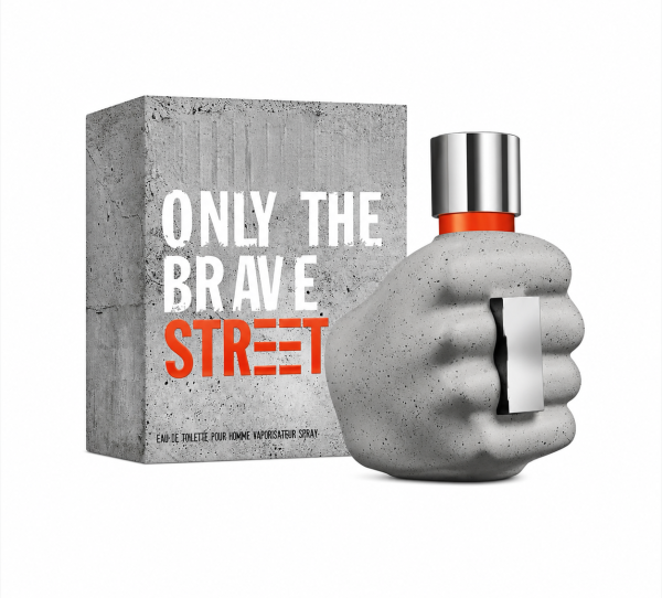 A bottle shaped like a clenched gray fist stands beside a matching box labeled "Diesel Only The Brave Street EDT Spray for Men, 50ml" in bold white and orange letters.
