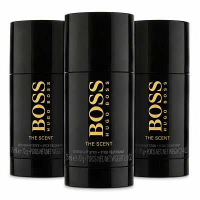 Three black Hugo Boss "The Scent" deodorant sticks are displayed upright, with the center stick slightly in front of the other two.