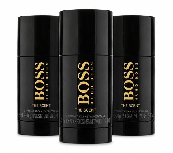 Three black Hugo Boss "The Scent" deodorant sticks are displayed upright, with the center stick slightly in front of the other two. Three black Hugo Boss "The Scent" deodorant sticks are displayed upright, with the center stick slightly in front of the other two.
