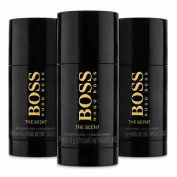 Three black Hugo Boss "The Scent" deodorant sticks are displayed upright, with the center stick slightly in front of the other two.