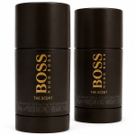 Two black cylindrical sticks of "Hugo Boss The Scent Deodorant Stick for Men, 75ml" are displayed upright against a plain white background. Set includes 2 deodorant sticks.