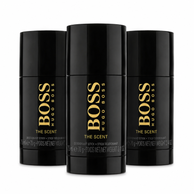 Three black Hugo Boss "The Scent" deodorant sticks are arranged against a white background, with one in front and two slightly behind.