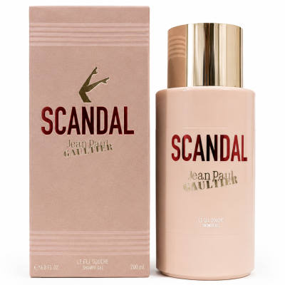 A bottle and box of Jean Paul Gaultier Scandal shower gel, featuring gold and red text with a gold cap and legs illustration on a beige background.