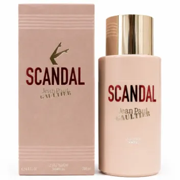 A bottle and box of Jean Paul Gaultier Scandal shower gel, featuring gold and red text with a gold cap and legs illustration on a beige background.
