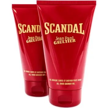 Two red tubes of Jean Paul Gaultier Scandal all over shower gel are displayed standing upright, with bold yellow text on the packaging.
