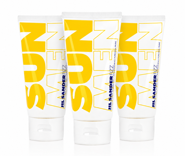 Three yellow and white Jil Sander SUN MEN tubes are standing upright side by side on a white background, with bold "SUN MEN" text displayed across the front of the packaging.