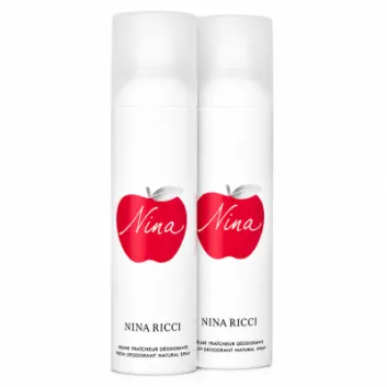 Three white Nina Ricci deodorant spray cans, each featuring a red apple graphic and "Nina" text on the front, are arranged side by side on a white background. Each can is labeled "Nina Ricci" and contains 150ml.