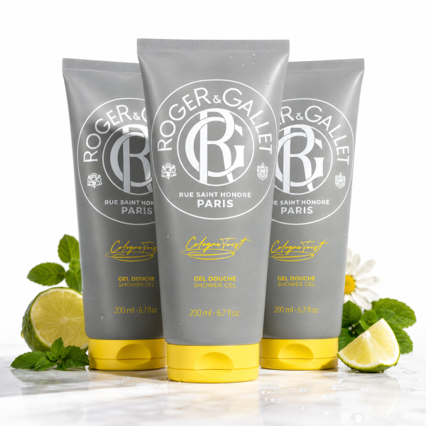 Three upright tubes of 3x Roger & Gallet Cologne Twist Shower Gel, Unisex, 200ml are displayed on a white surface with lemon slices, mint leaves, and chamomile flowers around them.