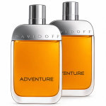 Two bottles of 2x Davidoff Adventure EDT Spray for Men, 100ml, featuring silver caps and orange liquid, are positioned side by side on a white background.