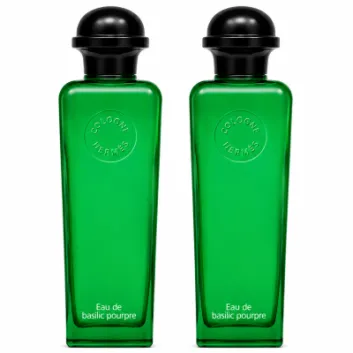 Two identical bottles of 2x Hermès Eau de Basilic Pourpre EDC Spray, Unisex, 100ml with black caps, are standing side by side on a white background.