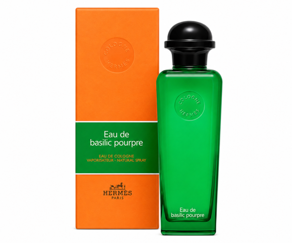 A green bottle of Hermès Eau de Basilic Pourpre EDC Spray, Unisex, 100ml is displayed beside its coordinating orange and green box, both featuring embossed logos and product information.