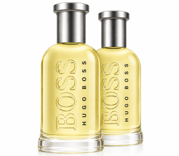 Two bottles of Hugo Boss Bottled Eau de Toilette for Men (100ml each) with silver caps and clear glass filled with light yellow liquid are placed side by side on a white background.