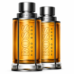 Two bottles of Hugo Boss The Scent Eau de Toilette for Men, 50ml each, stand side by side filled with amber liquid on a white background.