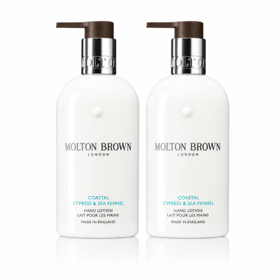 Two white pump bottles of Molton Brown Coastal Cypress & Sea Fennel Bath and Shower Gel (300ml each, unisex), each labeled with product and brand details in black and blue text.