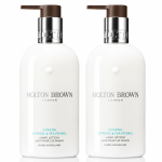 Two white bottles of Molton Brown Coastal Cypress & Sea Fennel Bath and Shower Gel, each 300ml and designed for unisex use, are placed side by side against a white background.