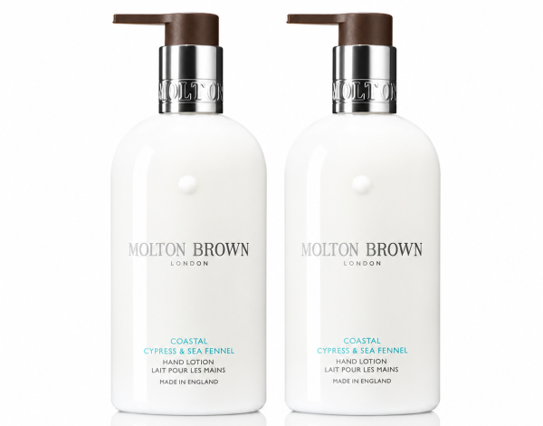 Two white bottles of Molton Brown Coastal Cypress & Sea Fennel Bath and Shower Gel, each 300ml and designed for unisex use, are placed side by side against a white background.