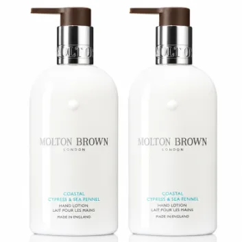 Two white bottles of Molton Brown Coastal Cypress & Sea Fennel Bath and Shower Gel, each 300ml and designed for unisex use, are placed side by side against a white background.