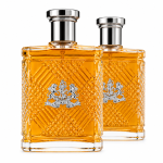 Two rectangular bottles of Ralph Lauren Safari Eau de Toilette Spray for Men, 125ml, filled with amber liquid and adorned with silver caps, feature a textured pattern and crest logo on the front. They are positioned side by side on a white background.