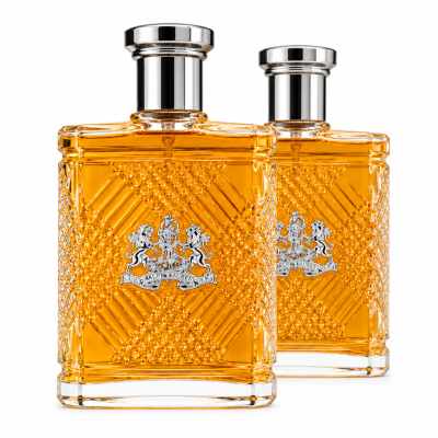 Two rectangular bottles of Ralph Lauren Safari Eau de Toilette Spray for Men, 125ml, filled with amber liquid and adorned with silver caps, feature a textured pattern and crest logo on the front. They are positioned side by side on a white background.