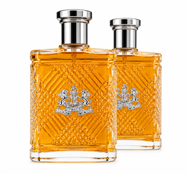 Two rectangular bottles of Ralph Lauren Safari Eau de Toilette Spray for Men, 125ml, filled with amber liquid and adorned with silver caps, feature a textured pattern and crest logo on the front. They are positioned side by side on a white background.