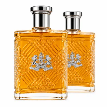 Two rectangular bottles of Ralph Lauren Safari Eau de Toilette Spray for Men, 125ml, filled with amber liquid and adorned with silver caps, feature a textured pattern and crest logo on the front. They are positioned side by side on a white background.