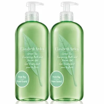 Three clear green pump bottles of Elizabeth Arden Green Tea Bath & Shower Gel for Her, 500ml each, featuring a leaf design and round stickers that read “Think Big Voyez Grand.”.