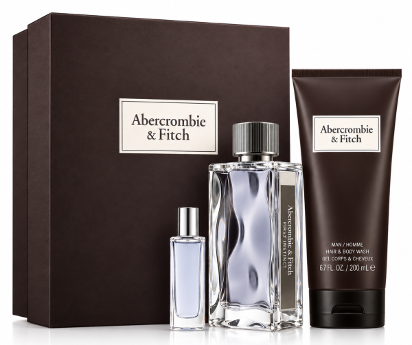 Abercrombie & Fitch First Instinct Gift Set for Men, featuring two EDT spray bottles (one large and one small), a tube of shower gel, and a dark rectangular box in the background.