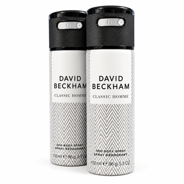 Two cans of David Beckham Classic Homme body spray and deodorant, each 150ml, with a white and gray chevron pattern and black caps, standing side by side.