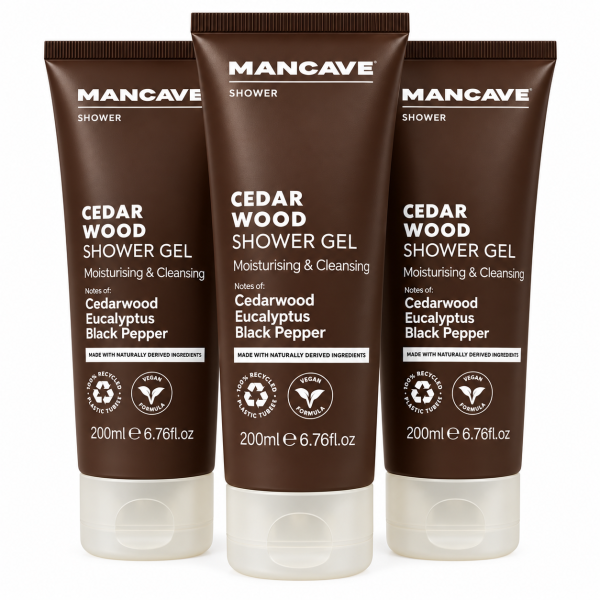 Three brown 200ml tubes of 3x ManCave Cedarwood Shower Gel, Man Cave, with white text highlighting cedarwood, eucalyptus & black pepper notes, upright on a white background.