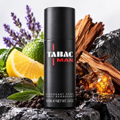 Three Mäurer & Wirtz Tabac Man Deodorant Sticks (75ml each) are displayed on black rocks, surrounded by lemon, herbs, lavender, amber, and wood.