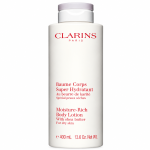A tall white bottle of Clarins Moisture-Rich Shea Butter Body Lotion 400ml with a light purple cap.