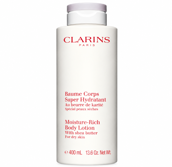 A tall white bottle of Clarins Moisture-Rich Shea Butter Body Lotion 400ml with a light purple cap.