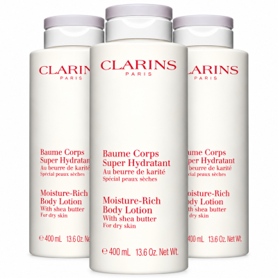 Three 400ml bottles of Clarins Moisture-Rich Shea Butter Body Lotion with red text and grey caps.