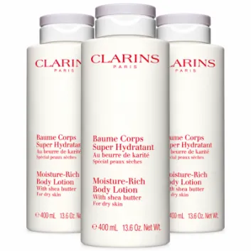 Three 400ml bottles of Clarins Moisture-Rich Shea Butter Body Lotion with red text and grey caps.
